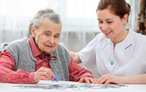 Nurse helps the senior after attending a CQC course